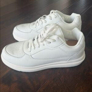 Height-enhancing shoes. These white sneakers add around 2.3-2.6 inches of height